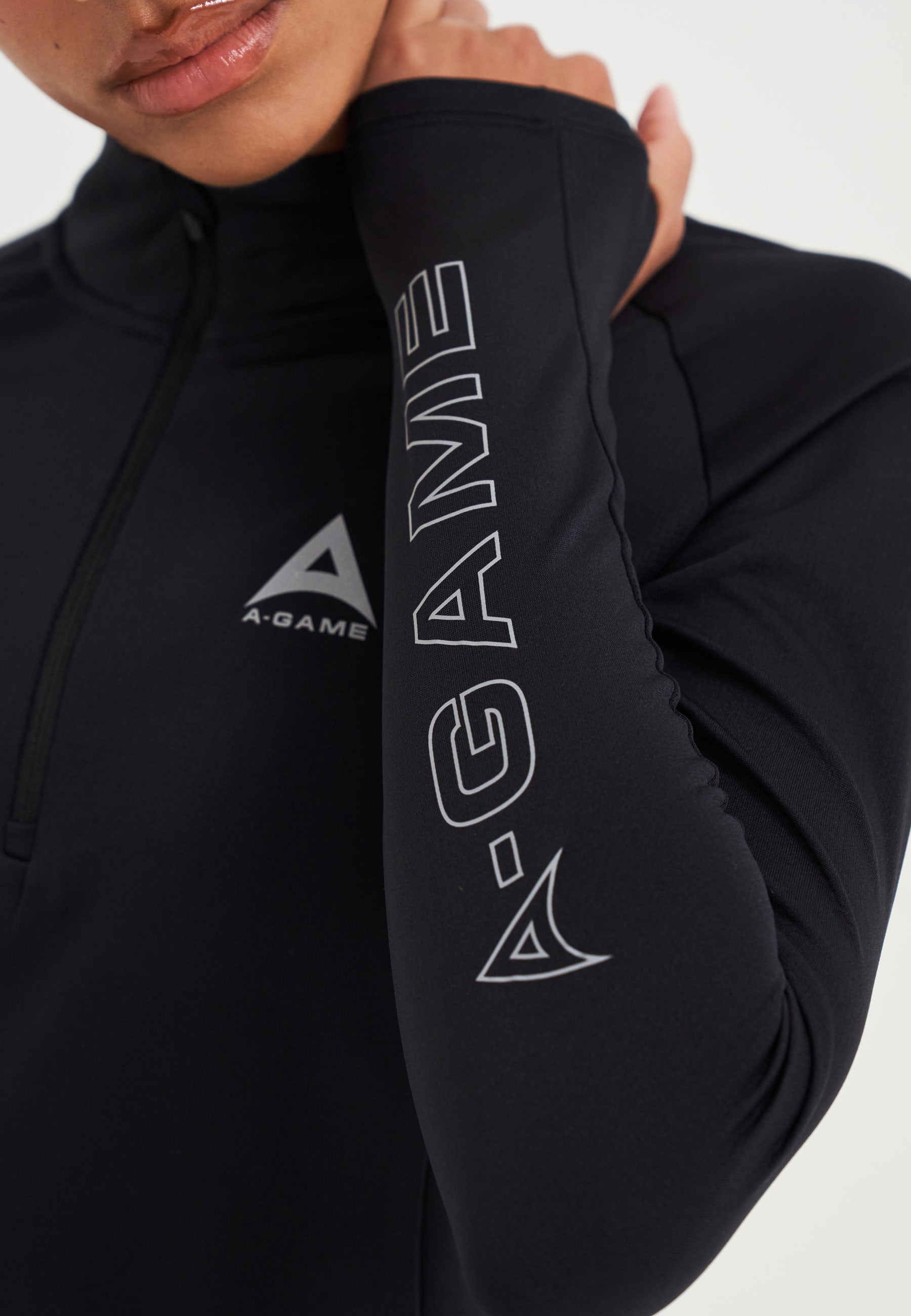 Top da allenamento aderente con zip A-Game Quarter da donna - Nero